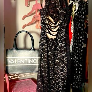 We have a Morgan and Cole lace, elegant dress with a lace back